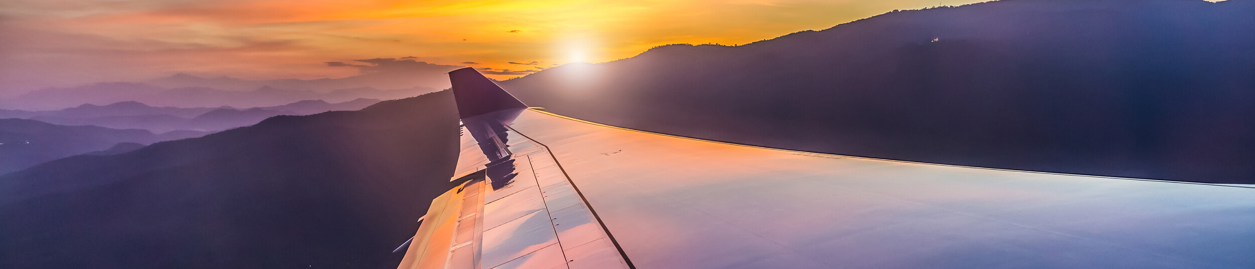 Overlooking mountains from a plane window